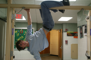Crazy Aidan hangs upside down in hall way header