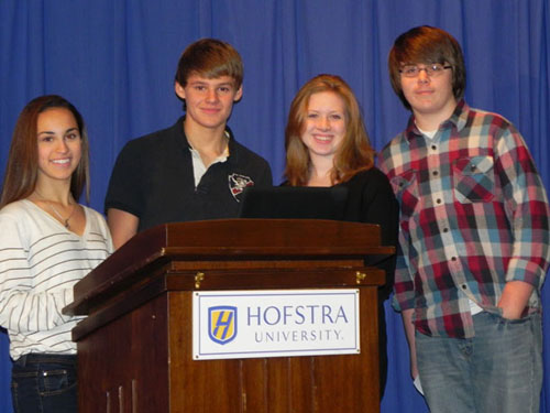 Freshmen Jules Robbins, Marc Cotter, Shannon Giere and Jesse Butcher prepare to present to parents about Facebook and Formspring.