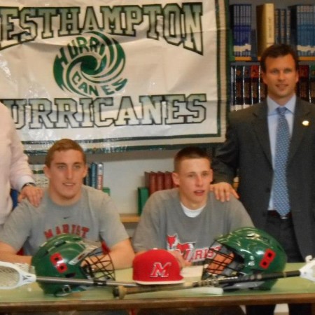 Ms. Masterson, Brian, Casey, And Mr.Herr pose for a picture before the two sign their commitment to Marist