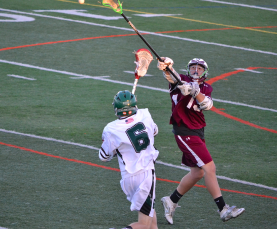 Sophomore Henry James Moreta attempts to block a Deer Park player's pass. 