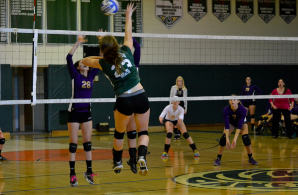 Junior Sarah Culver spikes over the net in last Thursday's game against Sayville. 