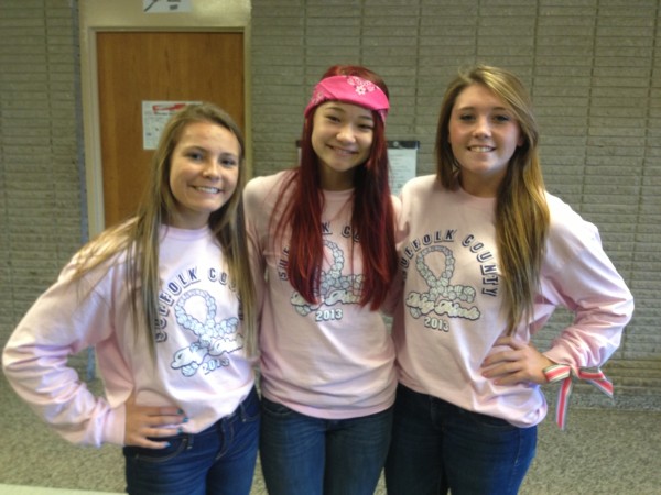 Sarena Choi (center) with seniors Alexa Smith (left) and Brenna Hogan (right) at the Dig Pink Bake Sale last Friday.