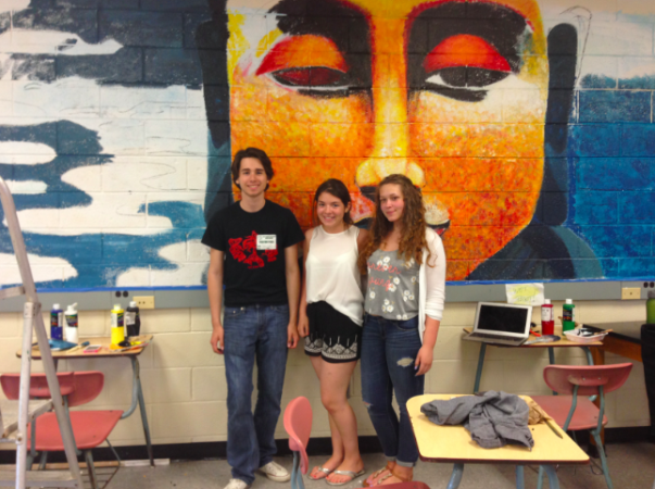 Connor Lynch, Daniela Tobar and Karen Quesada working on their mural. 