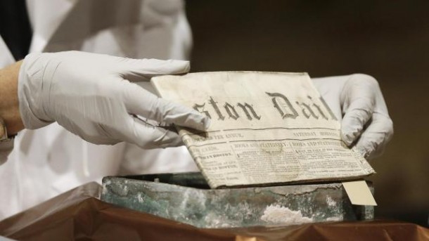 Museum+of+Fine+Arts+Boston+Head+of+Objects+Conservation+Pam+Hatchfield+removes+a+folded+19th+century+newspaper+from+a+time+capsule+at+the+museum%2C+Tuesday%2C+Jan.+6%2C+2015%2C+in+Boston.+The+original+capsule+was+made+of+cowhide+and+believed+to+have+been+embedded+in+a+cornerstone+when+construction+on+the+state+Capitol+building+began+in+1795.+The+contents+were+shifted+to+a+metal+box+in+1855+which+was+unearthed+last+month+at+the+Statehouse.%0D%0A