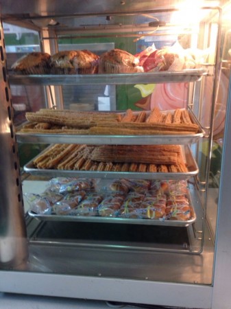 Churros feature prominently among muffins and other food items at the cafeteria.