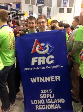 Alex Johnson (left) and Alex Jaquin (right) holding the winning banner.