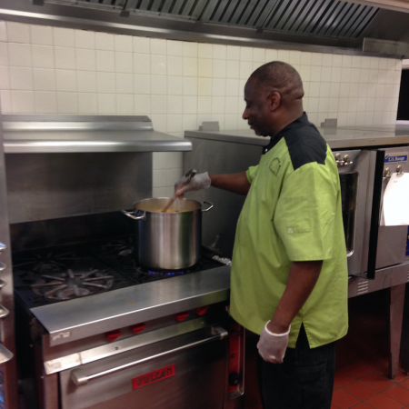 Chef Robert stirs hot soup in the WHBHS cafeteria on a sunny day in early May