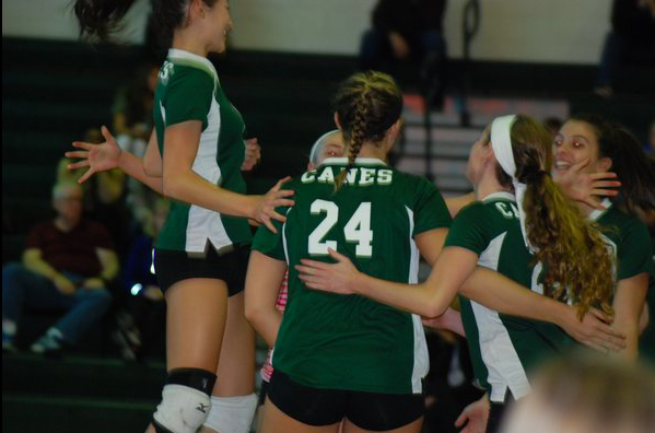 The girls celebrating at the game against Harborfields 
