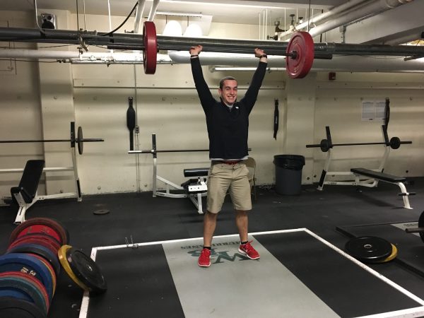 Mr.Wingler lifting weights in the weight room