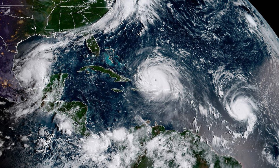 This satellite image obtained from the National Oceanic and Atmospheric Administration (NOAA) shows (L-R) Category 1, Hurricane Katia; Category 5, Hurricane Irma and, Category 1, Hurricane Jose at 1300UTC on September 7, 2017. / AFP PHOTO /Getty Images