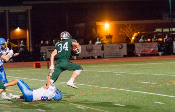 Liam McIntyre breaks away from a Rocky Point player at Friday nights game under the lights.