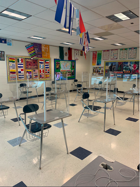 Plexiglass desk dividers shown here will be on all desks