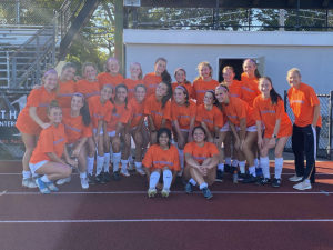 Girls Varsity Soccer team supporting Dezy Strong Foundation at their kicks for cancer game