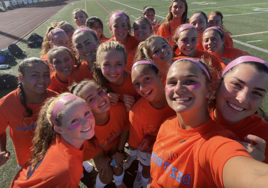 The 2021-22 Girls Varsity Soccer team at their kicks for cancer game