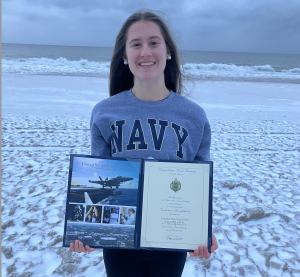 Sam with her certificate of commitment.