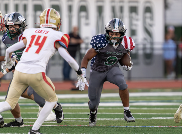 Nic #9 carries the ball against Hills West